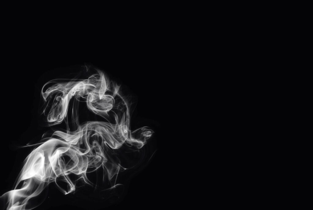 White smoke against a black background